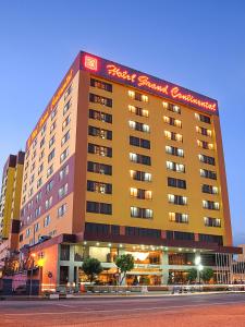 a large hotel building with a sign on it at Hotel Grand Continental Kuantan in Kuantan