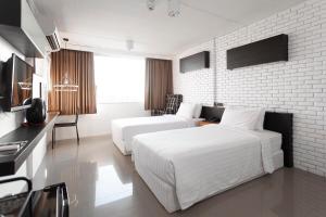 TV a/nebo společenská místnost v ubytování R1 Nimman Hotel Chiangmai