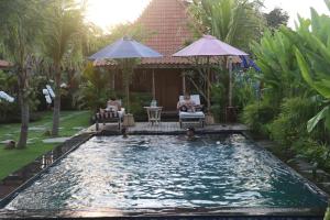 Bazén v ubytování Nauna Villa Ubud nebo v jeho okolí