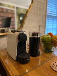 a toaster sitting on top of a counter next to a blender at OurStudio in Beverley