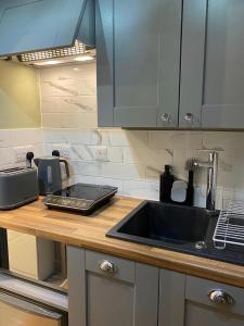 a kitchen with a sink and a counter top at OurStudio in Beverley +4 photos