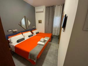 Postel nebo postele na pokoji v ubytování Albergo Villa Marina
