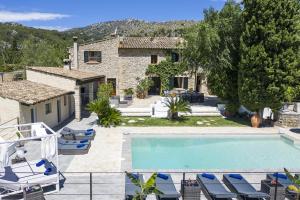 a villa with a swimming pool and a house at Villa Jaume Ramona in Pollença