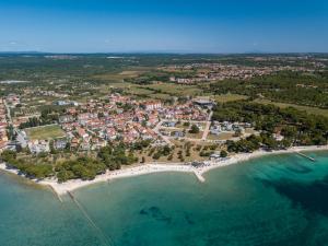 an aerial view of a resort on the beach at Hotel Villa Vera in Fažana