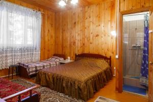 Postel nebo postele na pokoji v ubytování Гостевой дом Никус