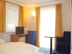 Μια τηλεόραση ή/και κέντρο ψυχαγωγίας στο Hotel Gasthof Seefelder Hof