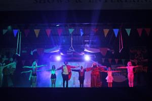 a group of people dancing on a stage at Centro Vacanze Pra' delle Torri in Caorle