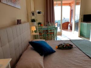 Säng eller sängar i ett rum på Residence Il Fiore Del Garda