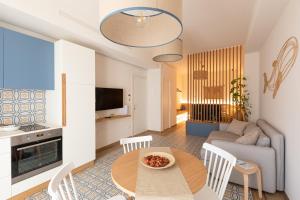 a living room with a table and a couch at Dimora Labbate in Polignano a Mare