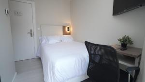Postel nebo postele na pokoji v ubytování Hotel Ciudadela Pamplona