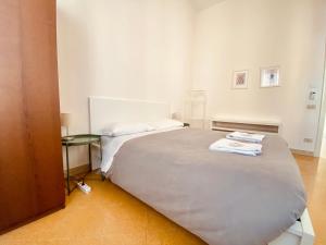 A bed or beds in a room at Mamamia #Politeama