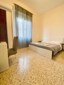A bed or beds in a room at Mamamia #Politeama