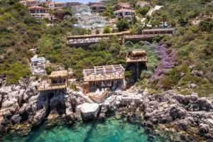 an aerial view of a resort on a rocky hill at Peninsula Gardens Hotel in Kas
