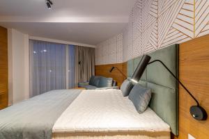 Posteľ alebo postele v izbe v ubytovaní Seaside Apartaments Deluxe 627