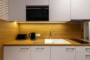 Kuchyňa alebo kuchynka v ubytovaní Seaside Apartaments Deluxe 627