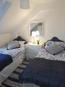 מיטה או מיטות בחדר ב-The Small House