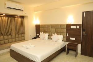Postel nebo postele na pokoji v ubytování Hotel Bandhan Residency