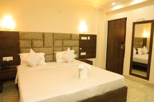 Postel nebo postele na pokoji v ubytování Hotel Bandhan Residency