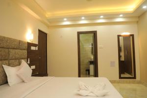 Postel nebo postele na pokoji v ubytování Hotel Bandhan Residency