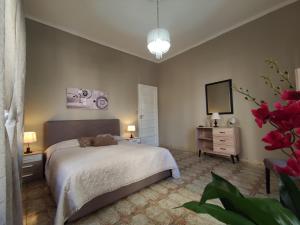 Un pat sau paturi într-o cameră la Appartamenti ai giardini
