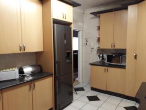 A kitchen or kitchenette at Robertsham (Halaal) Self Catering Cottages