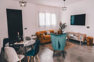 a living room with a couch and a table at Casa Tenique in Lajares