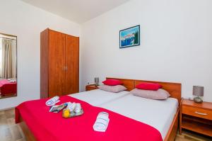 
Ein Bett oder Betten in einem Zimmer der Unterkunft Kljunak Apartment
