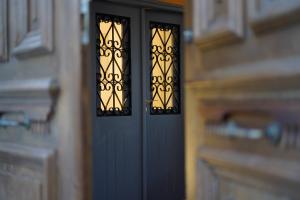 a close up of a black door in a house at The Courtyard Episkopi Guest Houses in Episkopi Limassol