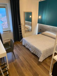 Postel nebo postele na pokoji v ubytování Hotel Europa