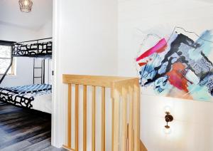 a bedroom with a bunk bed and a crib at Chalets Alpins - 12 Chemin Alpin in Stoneham +37 photos