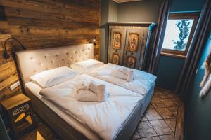 Postel nebo postele na pokoji v ubytování Nordic Lodge