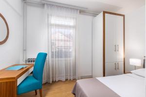 Postel nebo postele na pokoji v ubytování Hotel Zagreb