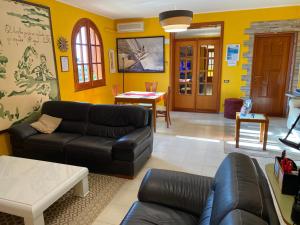 a living room with a couch and a table at Orlando Vacanze Camere in Erice