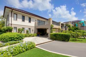 a house with a driveway in front of it at Beach View Hotel in Saint James