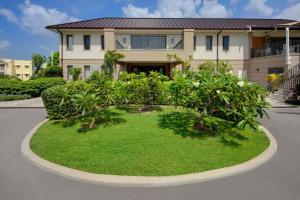 a house with a garden in front of it at Beach View Hotel in Saint James