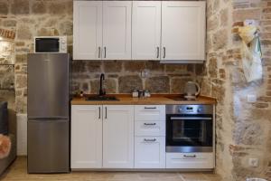 Kuchyň nebo kuchyňský kout v ubytování Stara Kala Varos Apartment
