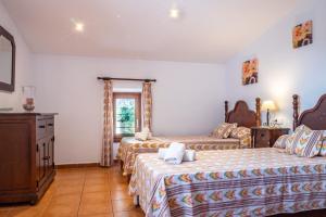 Postel nebo postele na pokoji v ubytování Finca ANGOIXES by Mallorca Villa Selection