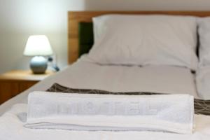 Postel nebo postele na pokoji v ubytování Garni Hotel Mala Moskva