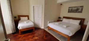 Ένα ή περισσότερα κρεβάτια σε δωμάτιο στο Brackloon Lodge-Brackluin