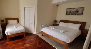 Ένα ή περισσότερα κρεβάτια σε δωμάτιο στο Brackloon Lodge-Brackluin