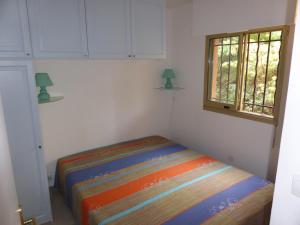 Ein Bett oder Betten in einem Zimmer der Unterkunft Plage de Miramar