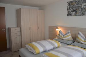 a bedroom with two beds with pillows on them at Chalet Aura in Livigno