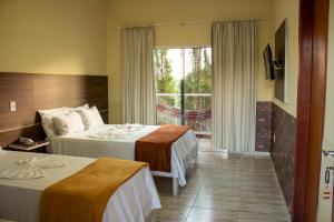 Postel nebo postele na pokoji v ubytování Hotel São Francisco