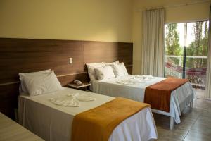 Postel nebo postele na pokoji v ubytování Hotel São Francisco