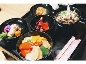 a group of bowls of food on a tray at Daichan Farm Guest House - Vacation STAY 19124v 