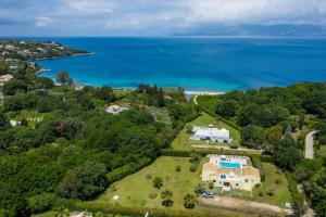 an aerial view of a house and the ocean at Villa Levanda by WhiteDream Villas in Kassiopi