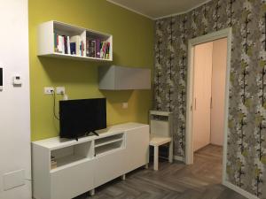 TV a/nebo společenská místnost v ubytování Appartamento Piccola Perla