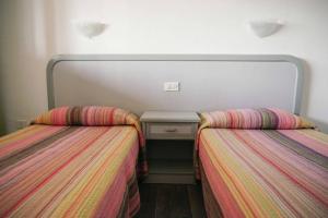 Ein Bett oder Betten in einem Zimmer der Unterkunft Primera linea playa, vista espectacular