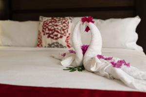 Voodi või voodid majutusasutuse Baker's Suites toas
