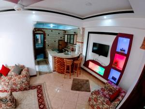 an aerial view of a living room and kitchen at Tara Apartments in Luxor